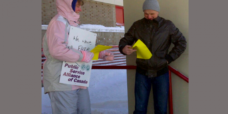 Striking airport workers take to the Hilltop