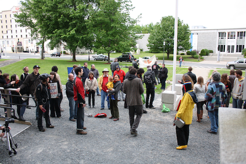 The crowd gathered for Casserole Night in solidarity with Quebec students moves towards Charles LeBlanc, the blogger who is banned from the N.B. Legislature grounds. Photo: Luc Walhain. adam-3