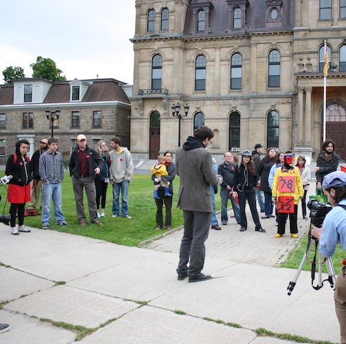 About 50 people clanged on pots and pans for about 1 hour in Fredericton on the second nation-wide Casserole Night in solidarity with striking Quebec students and for free, accessible education for all. Photo: Luc Walhain. adam-35