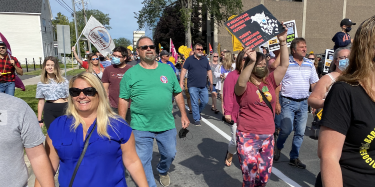 Hundreds march in 14 communities across New Brunswick in solidarity with front-line workers